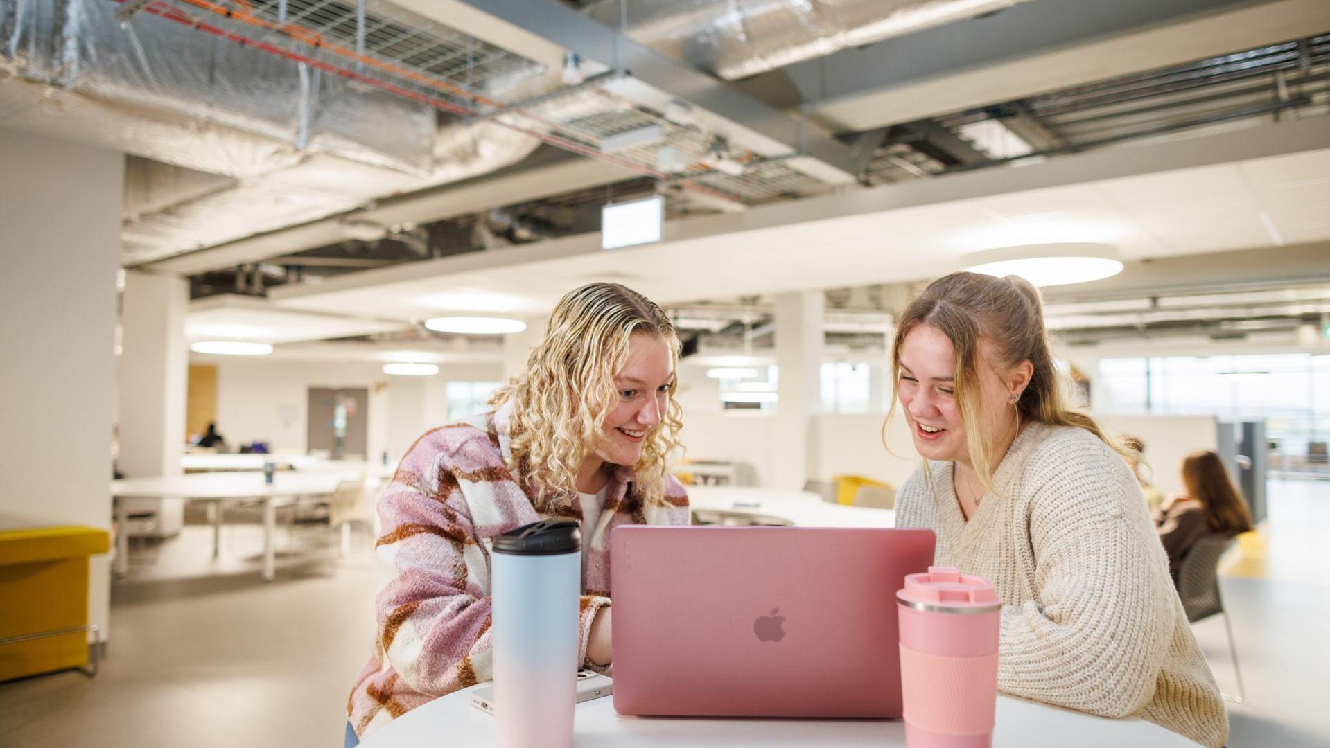 Students looking at laptop, study space, Verena Holmes, Canterbury,